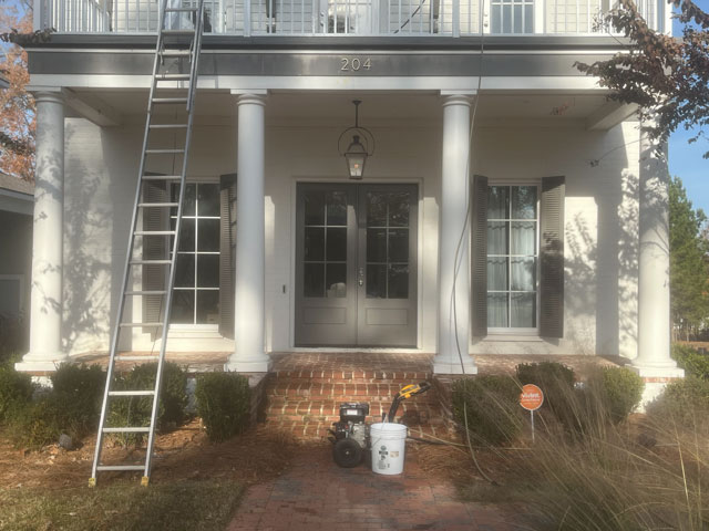 Home porch and columns during exterior repaint
